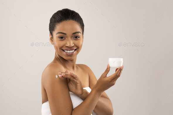 Cheerful Young Black Woman Wrapped In White Bath Towels Stock