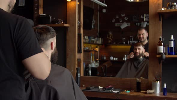 Barber Cutting Hair of Male Client