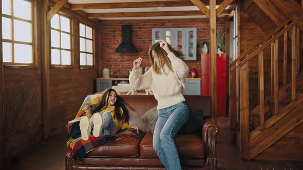 Young Mother and Little Daughter Falling Down on Sofa Laughing and Tickling Each Other, Stock Footage->