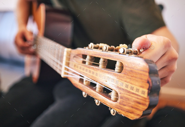 Hands, person and tuning guitar for music, talent and creative skill in sound production. Closeup,