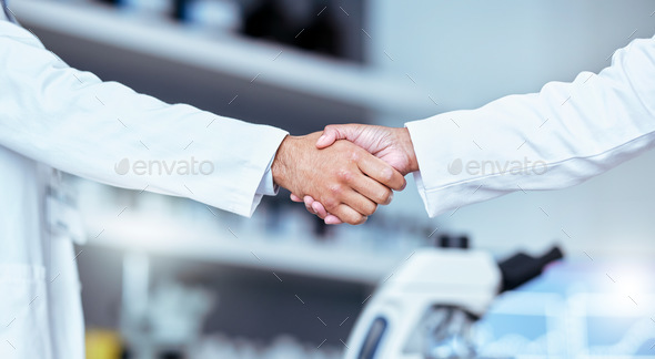 Handshake, partnership and laboratory scientist, people or team work, collaboration and cooperation