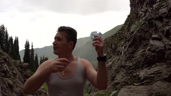 Guy in the Mountains Takes Off His Medical Mask alt