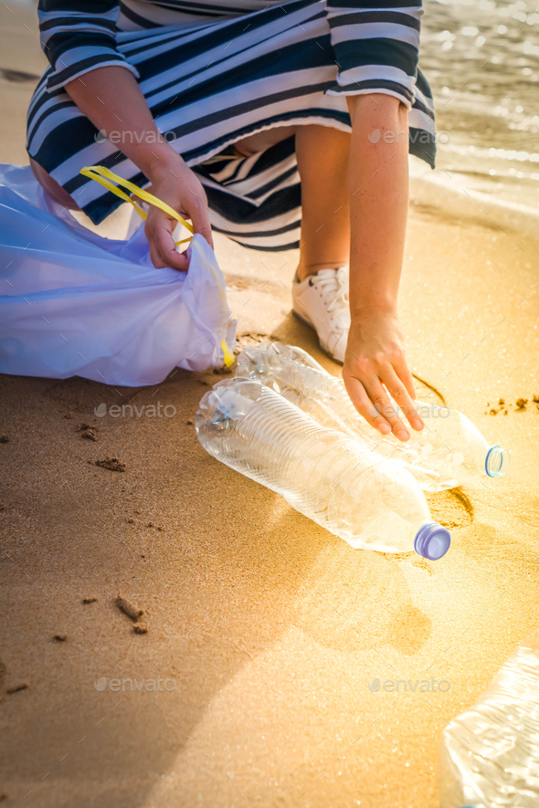 cleaning plastic on the beach.