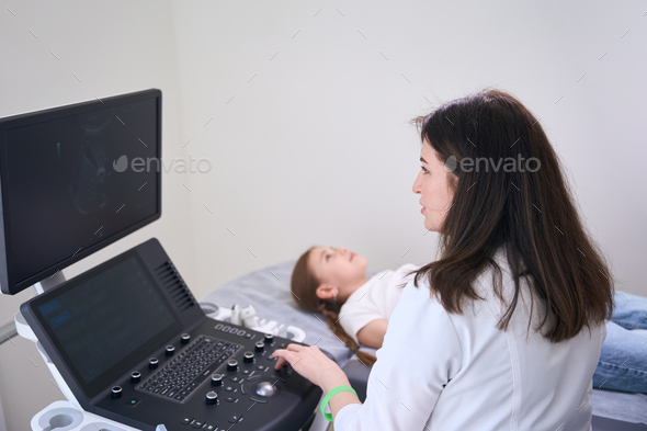 Calm girl lies on the couch in the ultrasound room