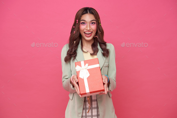 Happy beautiful Asian teen woman smile with red gift box Stock