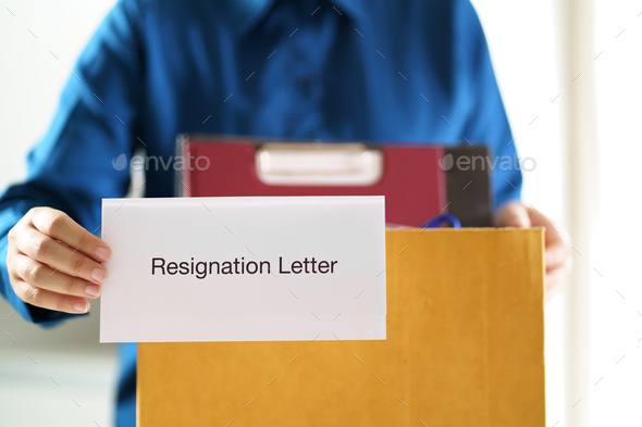 Quit Job Business man sending resignation letter and packing
