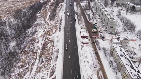 Suburban Highway with Cars and Multistorey Buildings in Winter Aerial View alt