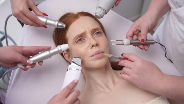 Image of a Young Woman, Around Her Face Many Hands of Cosmetologists with Various Cosmetic Devices alt