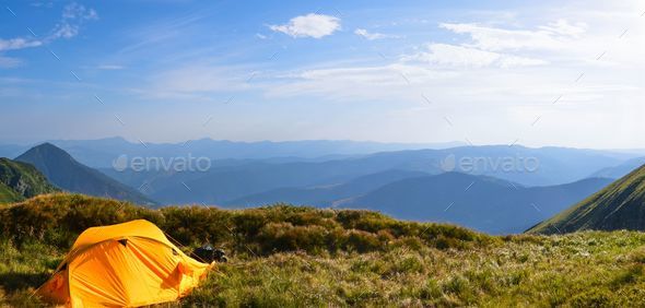 Tent Surrounded With Camping Or Outdoor Equipment Hiking