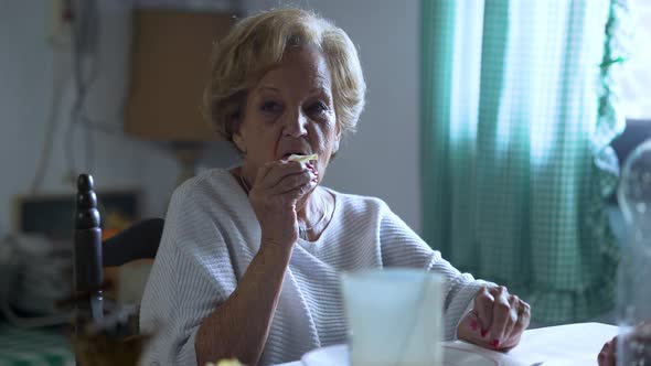 Funny Senior Lady Eating Potato Chips