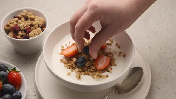 Muesli with yogurt, fresh berries and chocolate sauce