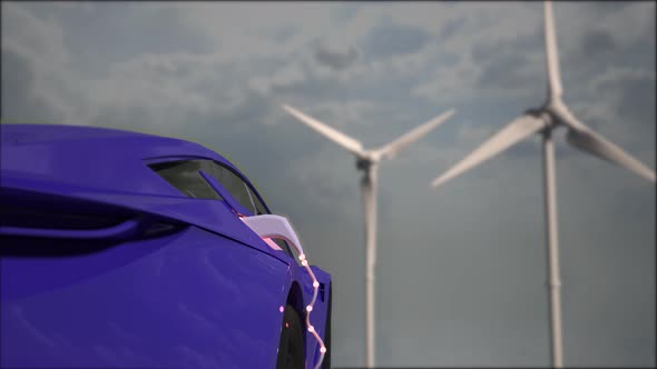 Generic electric blue car charging with wind turbines in background.