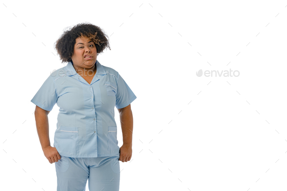 young Afro-Latin nurse woman looking at the camera with a disgusted face, white background