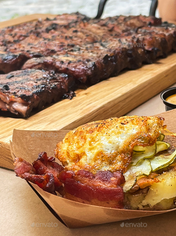 Restaurant outdoor, grass fed prime rib roast with herbs and spices Stock Photo by maksymiv