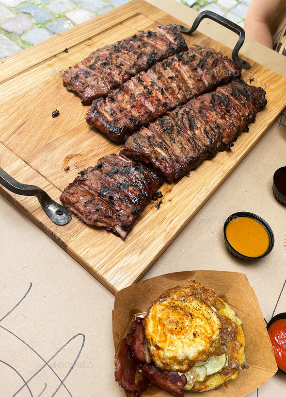 Restaurant outdoor, grass fed prime rib roast with herbs and spices Stock Photo by maksymiv