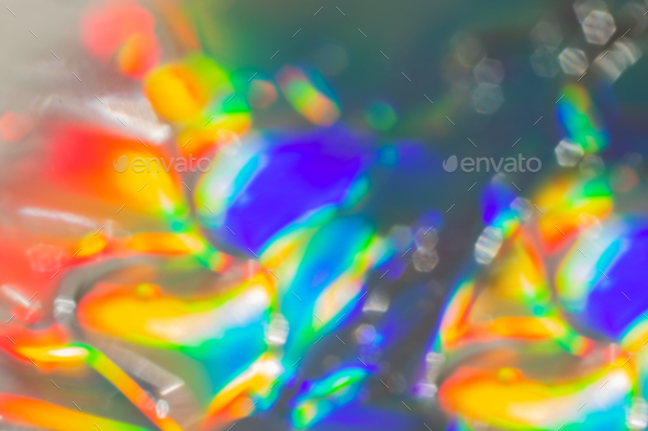 Abstract cosmetics gel on holographic background.Good as cosmetic banner. Defocused photography.
