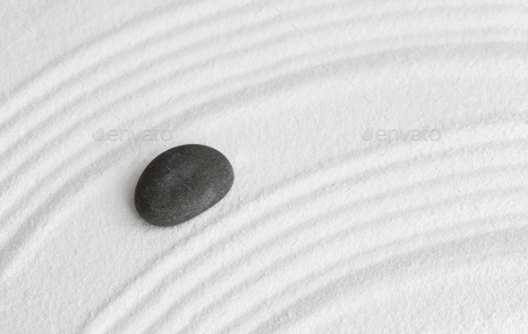 Zen Garden, Grey stone on White Sand Wave Pattern in Japanese stye,Rock Sea Stone on Sand texture