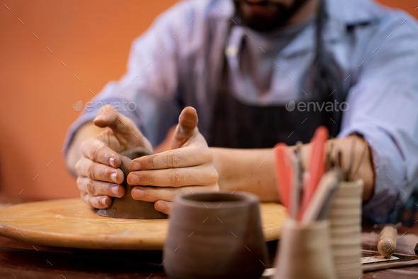 earthenware The art of sculpting clay with ceramics being molded by hand  Stock Photo by sarawut20003