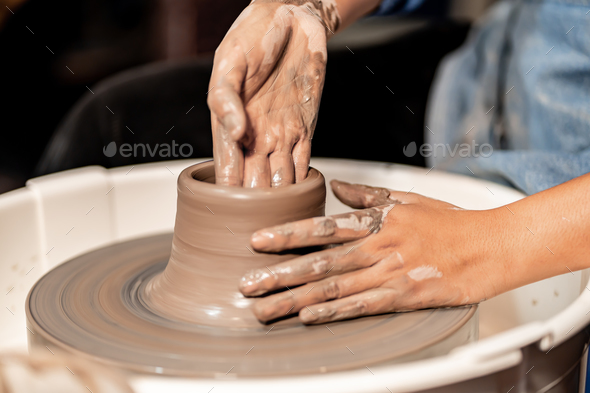 earthenware The art of sculpting clay with ceramics being molded by hand  Stock Photo by sarawut20003