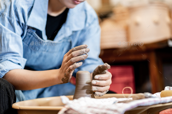 earthenware The art of sculpting clay with ceramics being molded by hand  Stock Photo by sarawut20003