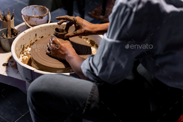 earthenware The art of sculpting clay with ceramics being molded by hand  Stock Photo by sarawut20003