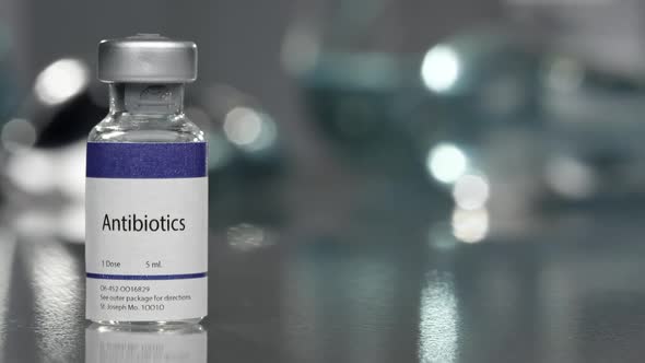 Antibiotics vial in medical lab on left side alt