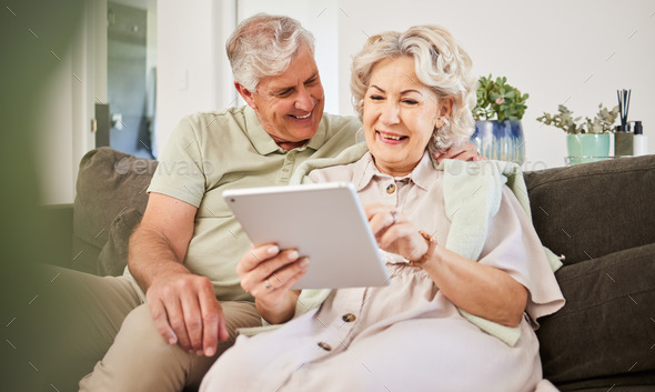 Senior couple, tablet and smile on sofa in home living room for news app, movies or streaming inter
