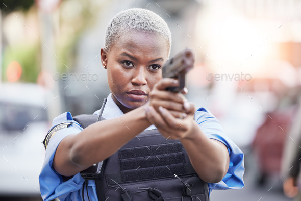 Gun, serious and female police officer in the city for an arrest to stop crime in a street. Upset,