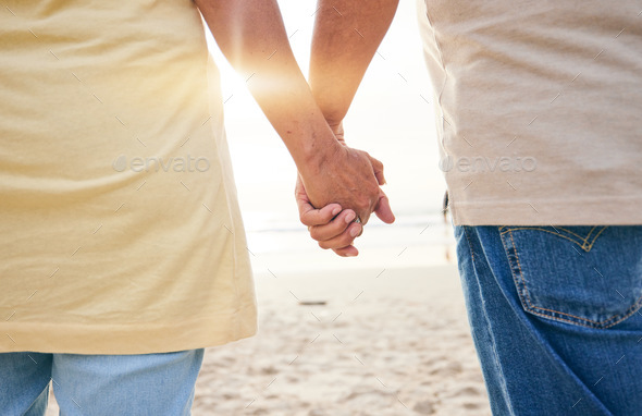 Senior, love and couple holding hands at the beach in support or help of health crisis, cancer or m