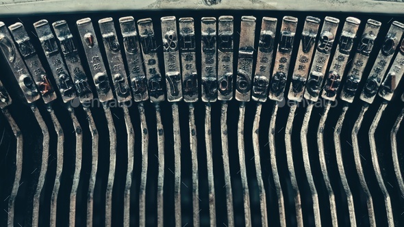Typo keys of a old manual typewriter typing on a retro writing machine