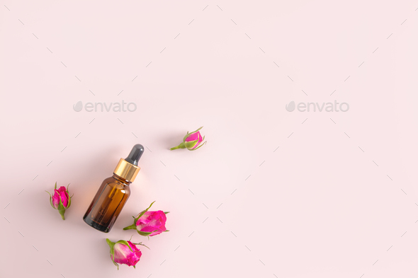 Cosmetic bottle with amber glass dropper with cosmetic product, serum or oil for face and body