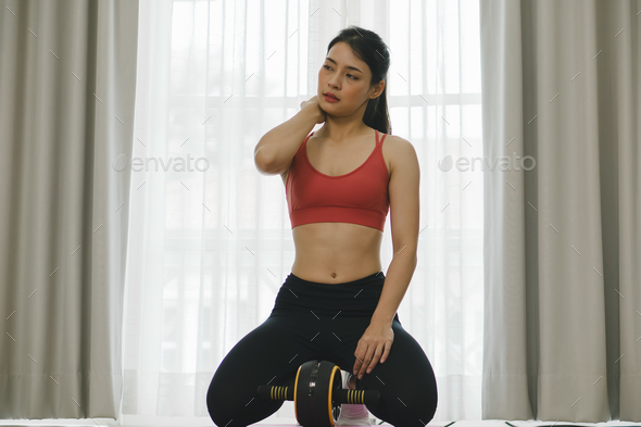Elegance in Motion: Beautiful Asian Woman Exercising at Home