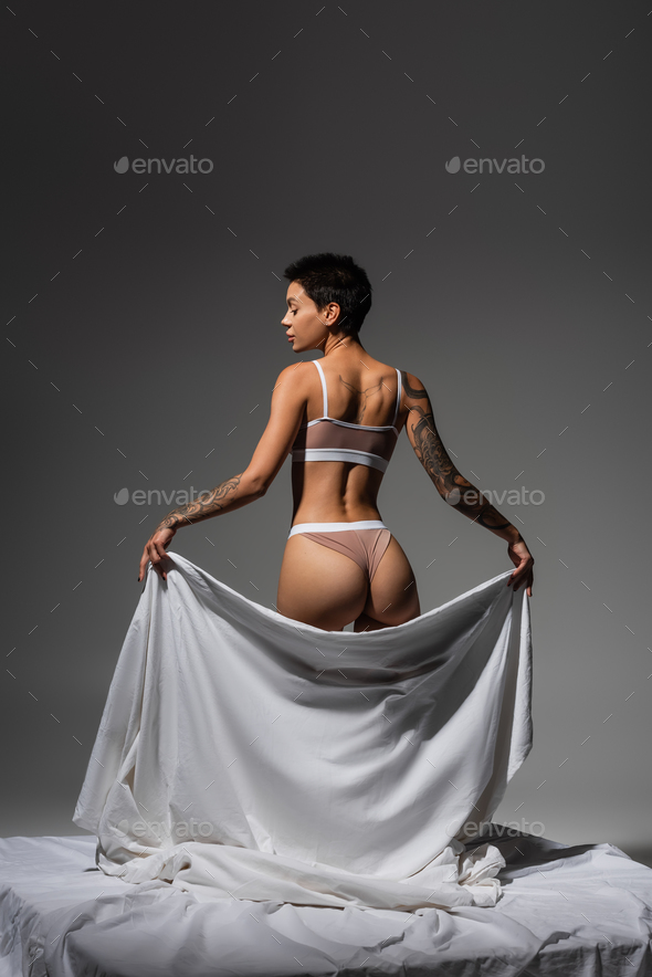 Foto de Sexy woman in beige lingerie do Stock