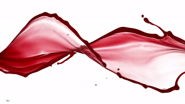 Super Slow Motion Shot of Red Wine Spiral Splash Isolated on White Background at 1000Fps alt