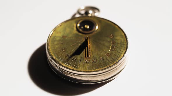 Sundial From the Rays of the Sun Show Time. White Background. Close Up alt
