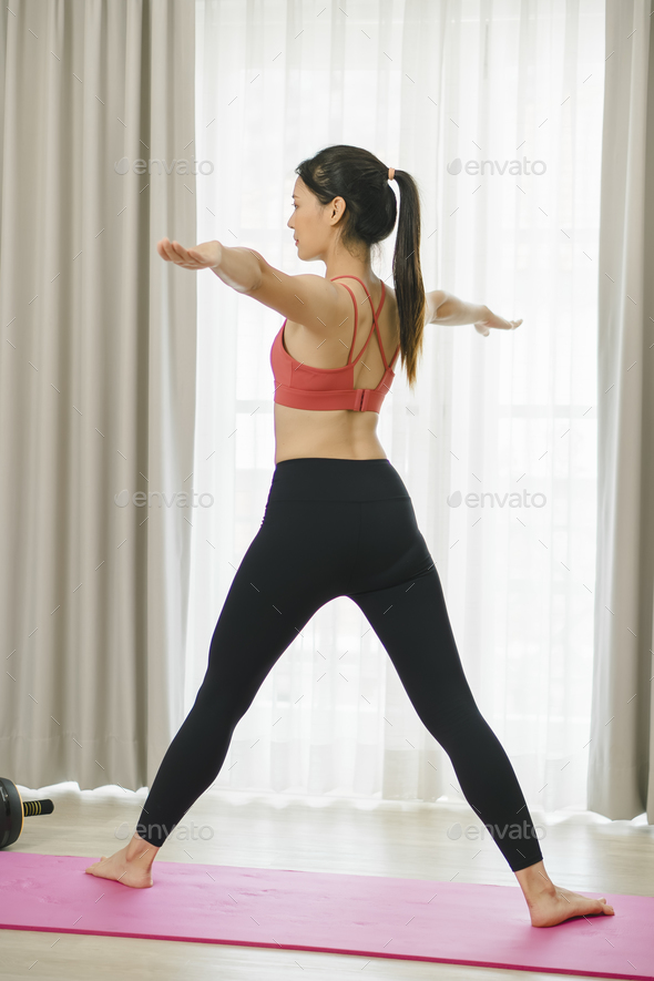Inner Harmony: Asian Woman Embracing Yoga at Home