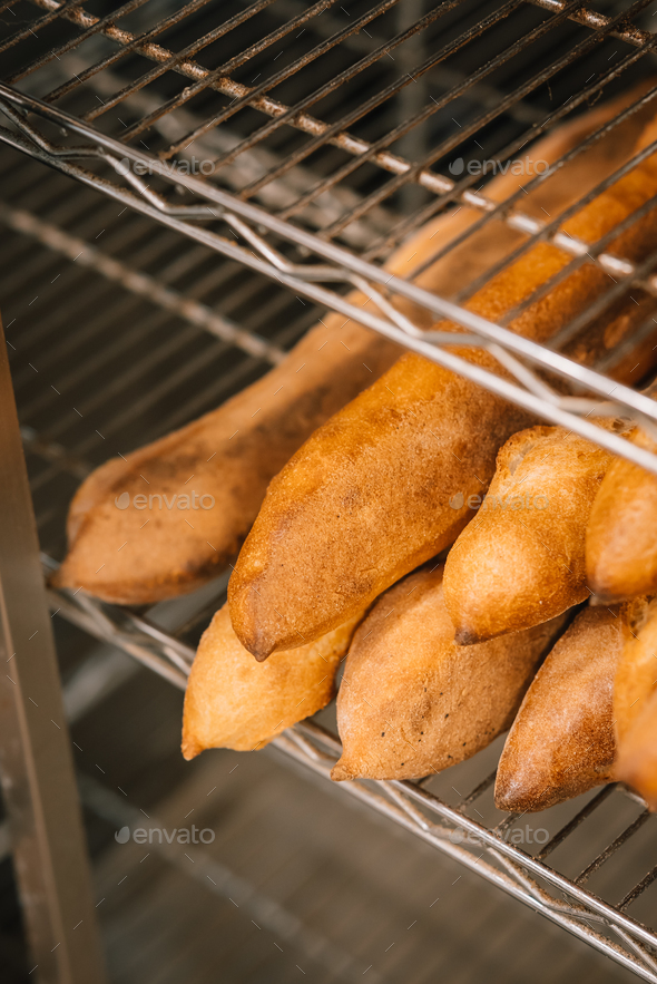 The oven contains ovenfresh bread. Stock Photo by simbiothy PhotoDune