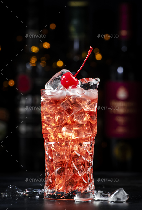Rose with cherry, alcoholic cocktail drink with pink vermouth, amaretto