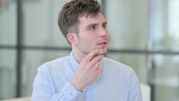 Portrait of Pensive Young Man Thinking alt