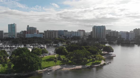 Beautiful downtown Sarasota, Florida as seen from a drone.  Lush green waterfront park and harbor ar alt