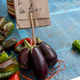 Fresh aubergine or eggplant sold at an Italian market (cesta translation: basket) - PhotoDune Item for Sale