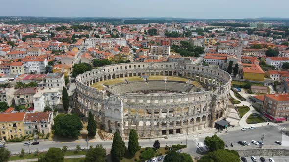 Aerial forwarding shot over Roman Arena in Pula, Istria, Croatia which is a  Unesco World Heritage s alt