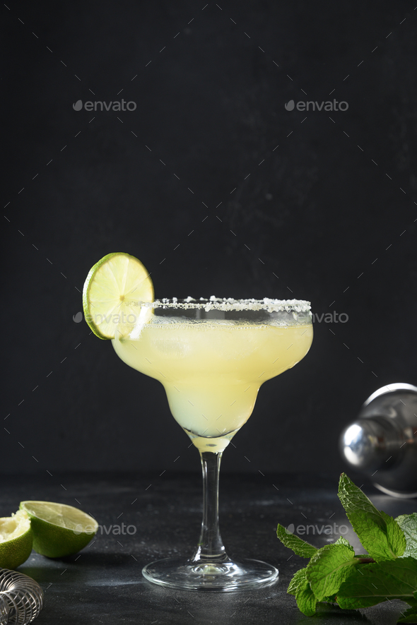 Classic Margarita cocktail with lime. Freshness summer alcoholic beverage.