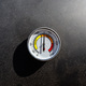 A round thermometer showing 130 degrees Celsius placed on a charcoal grill. - PhotoDune Item for Sale