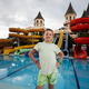 Portrait of a boy on the background of a water park. - PhotoDune Item for Sale