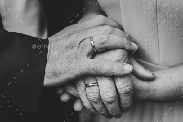 Senior woman and man hold hands with each other, retirement life. Elderly community concept,