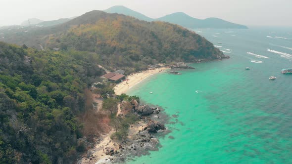 Green Hilly Ocean Islands with Beaches and Racing Boats alt