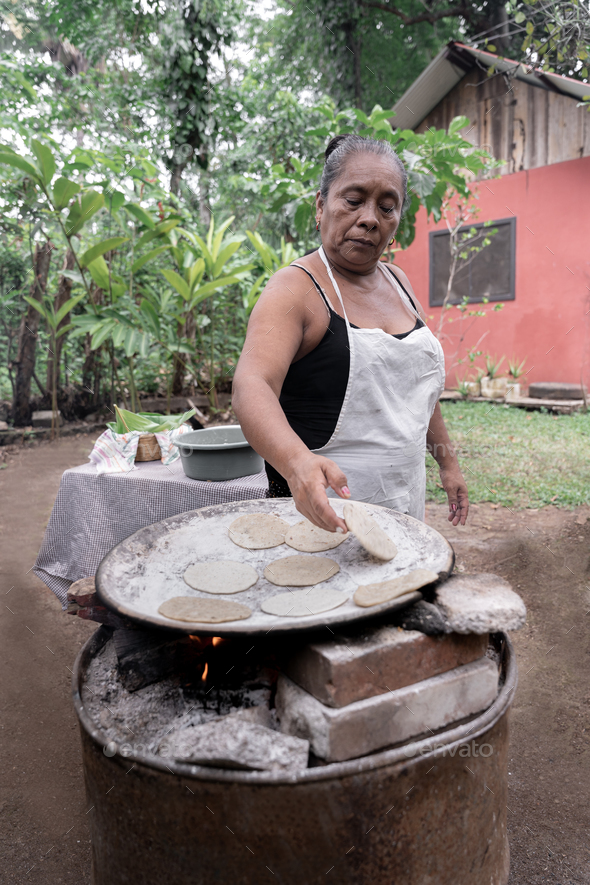 Handmade Tortillas Cooking on the Comal in Guatemala Stock Photo