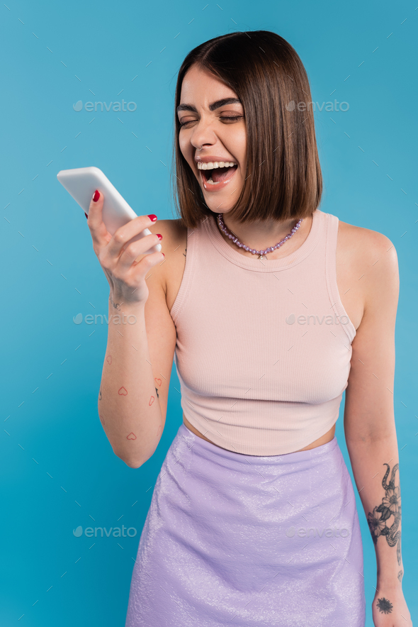 Sending A Message Excited Young Woman Short Hair Tattoos And Nose Piercing Using Mobile Phone 6950