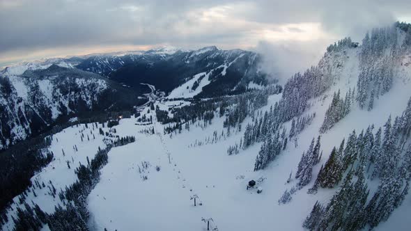 Winter Ski And Snowboard Resort Aerial Above Chairlifts alt